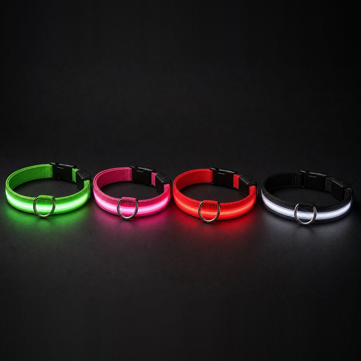 The four Glow Pup collars glowing green, pink, red and white